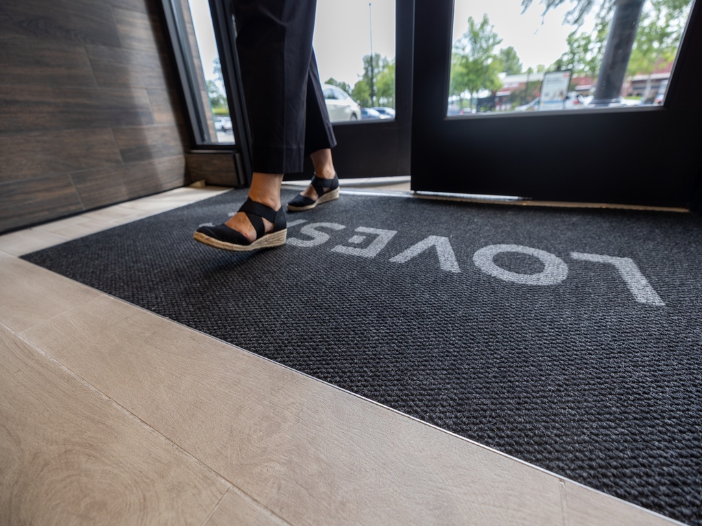 Diamond commercial entrance matting installed across an entry path